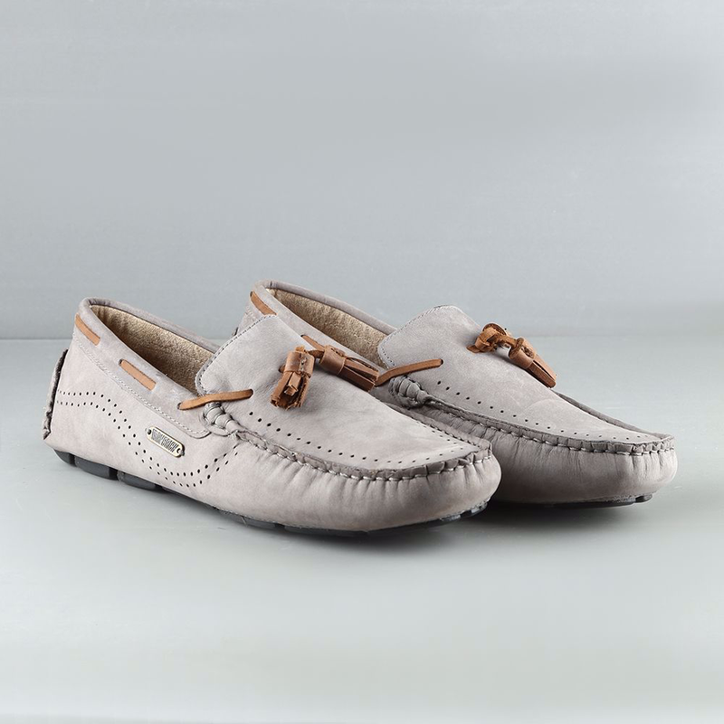 Classic tasseled loafer features supple suede